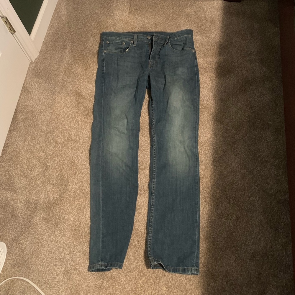 A pair of American Eagle original riveted jeans.